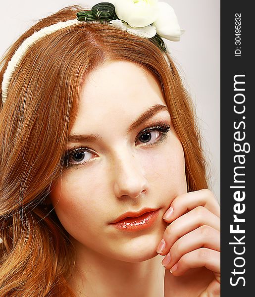 Goodness. Portrait of Young Meek Woman with White Flower on her Head