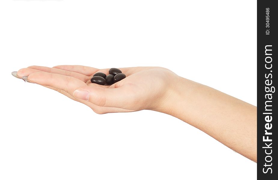 Woman holding a capsule close-up. Woman holding a capsule close-up