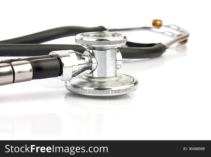 Metallic stethoscope on white background, medical equipment photo