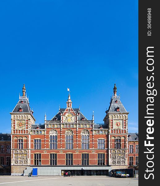 Main Building of the Amsterdam Central Train Station after the rushing hours at Amsterdam, Netherlands