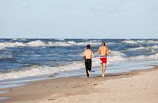 Boys Running On The Beach Royalty Free Stock Photo