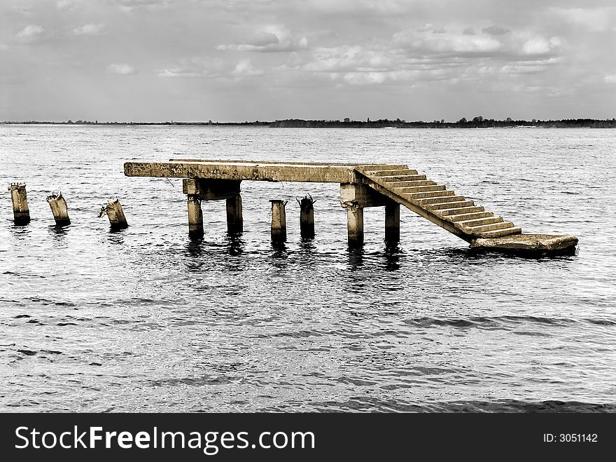 Part of the destroyed pier in water