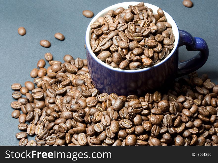 Beans In Cup On Coffee