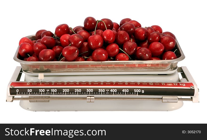 The cherry and scales, isolated on white with clipping path. The cherry and scales, isolated on white with clipping path.