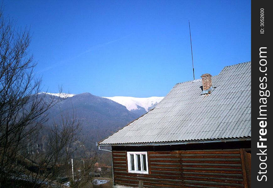 This is a photo of a lodge from Romanian mountains, made in the winter time