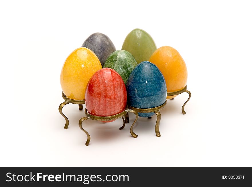 Some beautiful colored eggs over white background. Some beautiful colored eggs over white background