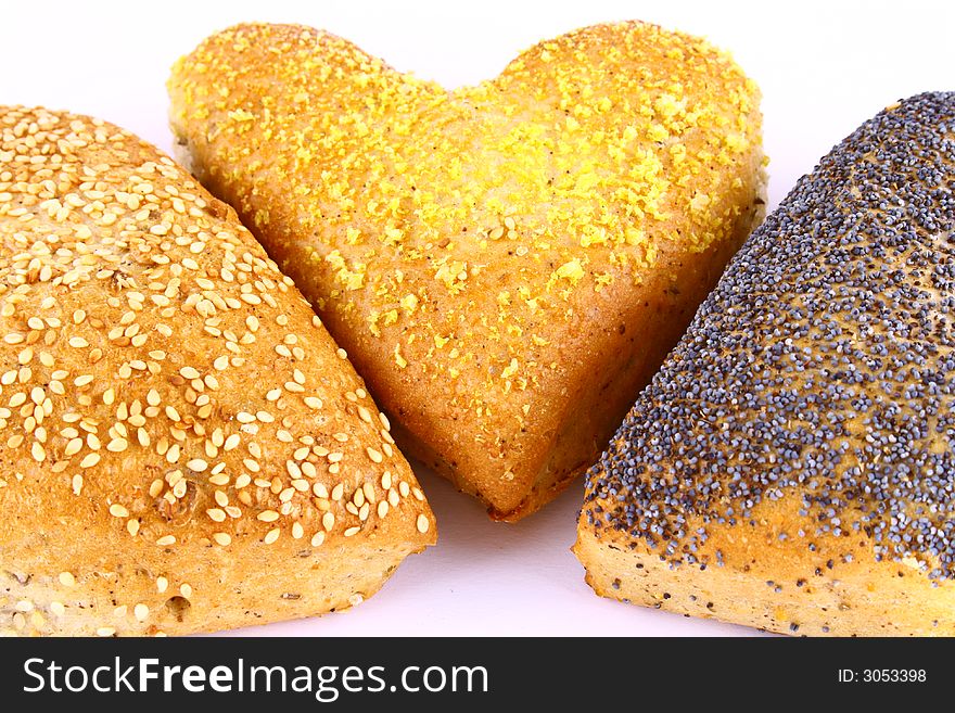 Different bread arranged on table close up. Different bread arranged on table close up