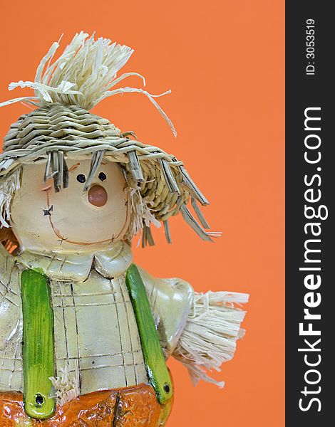 Scarecrow Halloween decoration on orange background