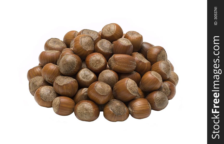 Oval bunch of hazelnuts isolated on white background