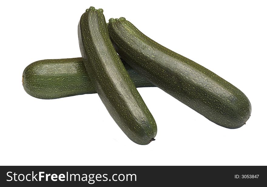 Three fresh french mini marrows courgettes isolated on white background