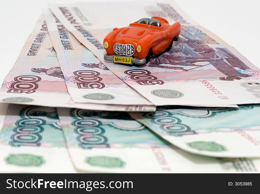 Small red car on the Russian roubles. Small red car on the Russian roubles