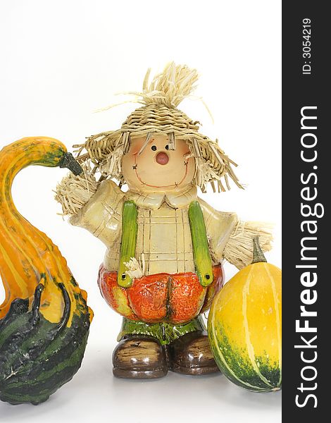 Scarecrow Halloween decoration with two pumpkins on white background