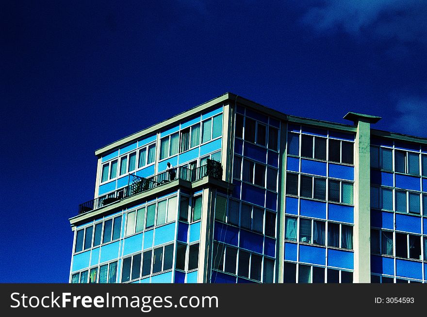 Blue apartment building on a sunny summer day