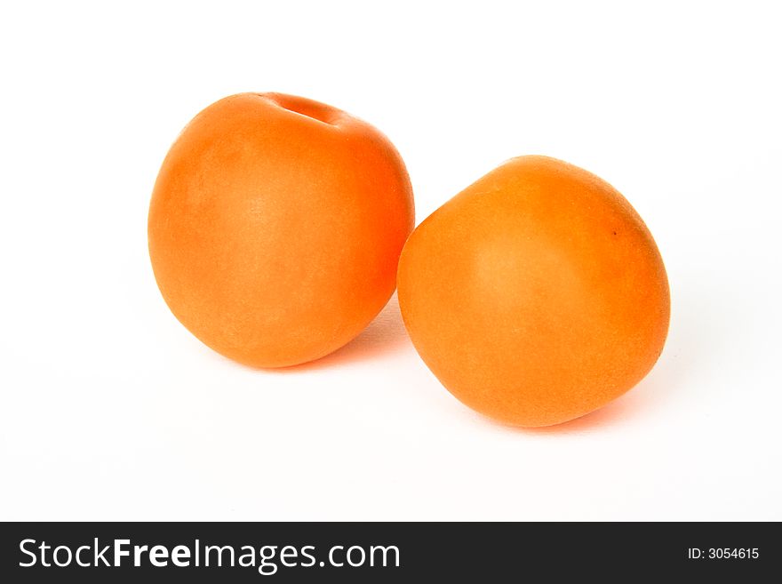 Two apricots isolated on white background. Two apricots isolated on white background