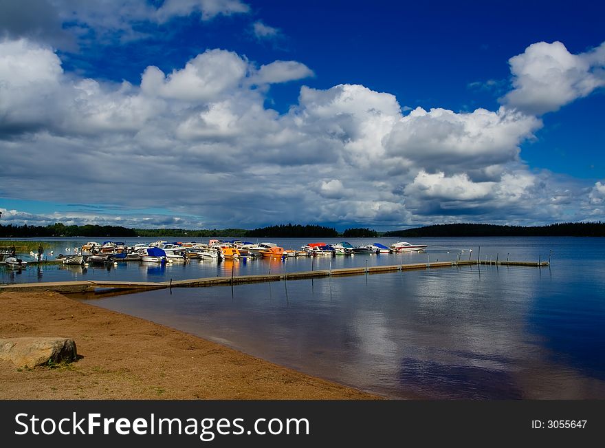 Beach at lakeside on summer afternoon. Beach at lakeside on summer afternoon