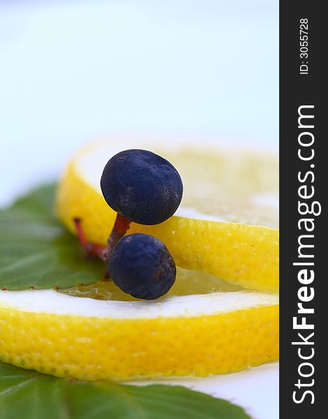 Close up of the two grapes on the lemon