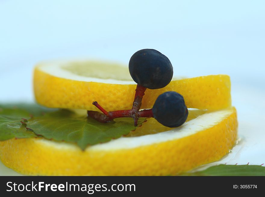 Close up of the two grapes on the lemon