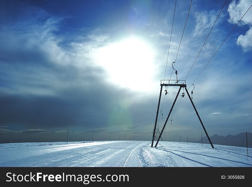 Ski-lift in back-light; high mountain, summer ski area, Zermatt; Swiss. Ski-lift in back-light; high mountain, summer ski area, Zermatt; Swiss.