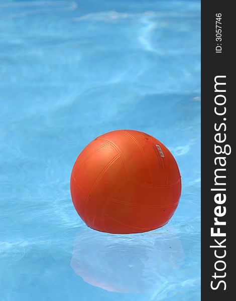 Red balloon in a blue swimming pool