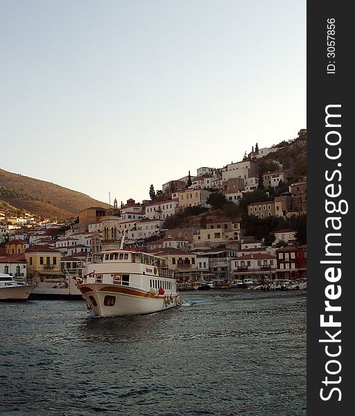 Boat at Greek island in afternoon sun