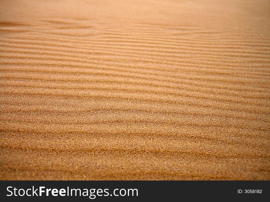 Dune sand texture, 
dark, gold sand