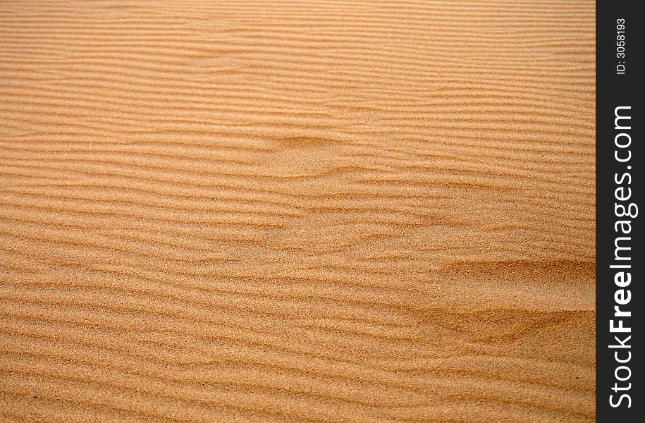 Dune sand texture, 
dark, gold sand