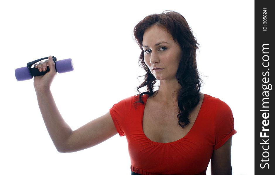 Pretty girl in red top working out with dumbbell. Pretty girl in red top working out with dumbbell