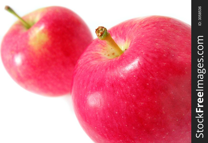 Two red apples isolated on white