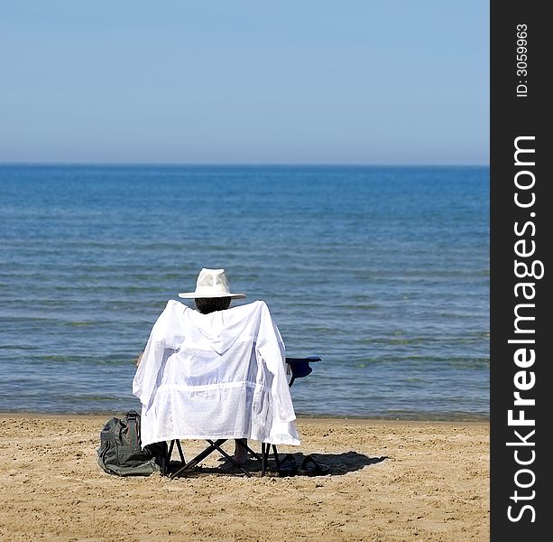 Woman relaxing and sunning on the beach. Woman relaxing and sunning on the beach