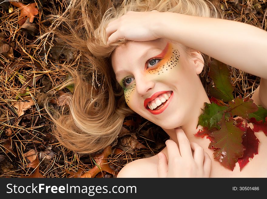 Happy teenager in a forest in the autumn. Happy teenager in a forest in the autumn