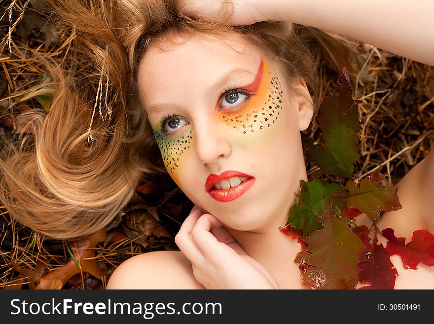 Happy teenager in a forest in the autumn. Happy teenager in a forest in the autumn