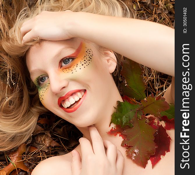 Happy teenager in a forest in the autumn. Happy teenager in a forest in the autumn