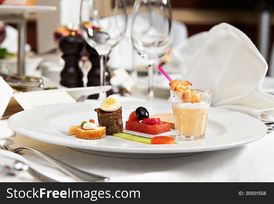 Dish with appetizers on festive table