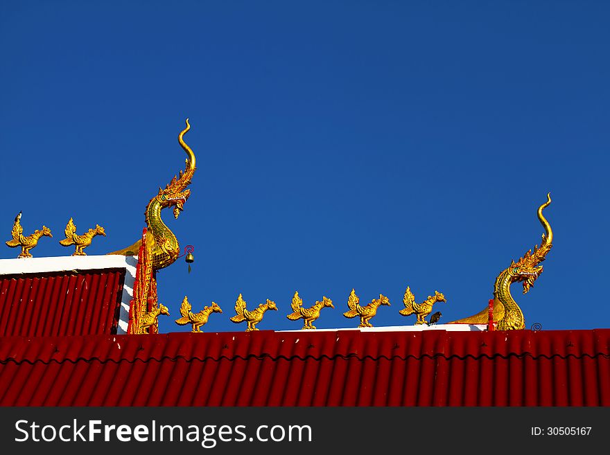 Heat dragon and statue chicken with bird at Wat Don keaw of Nan, Thailand