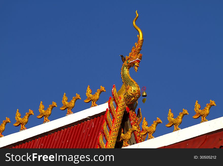 Beautiful head dragon and chicken with sky at Wat Don keaw of Nan, Thailand