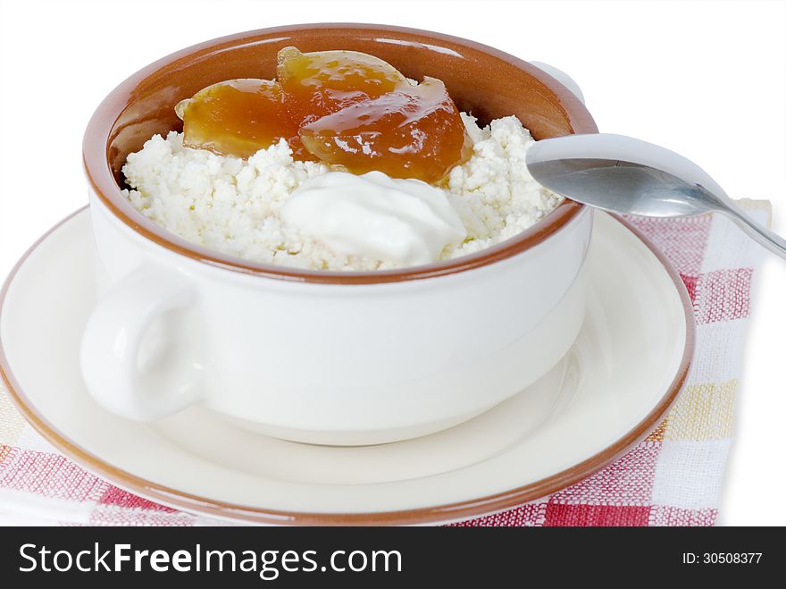 Cottage cheese with pear jam and sour cream in a ceramic bowl. Cottage cheese with pear jam and sour cream in a ceramic bowl