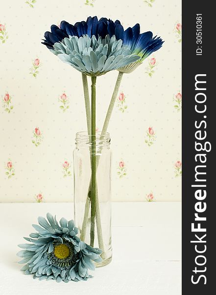 A blue fake flowers still life