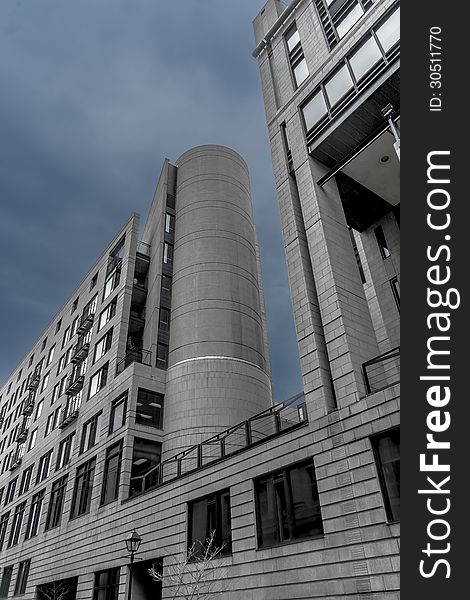Tall modern building with a metallic an glass facade. Tall modern building with a metallic an glass facade