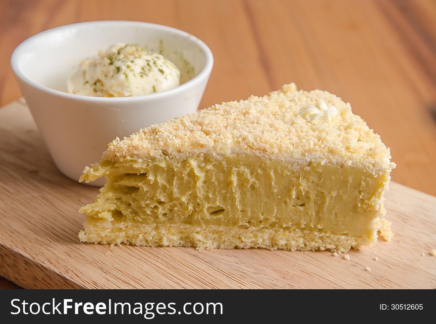 Potato Cake with cream on a wooden plate