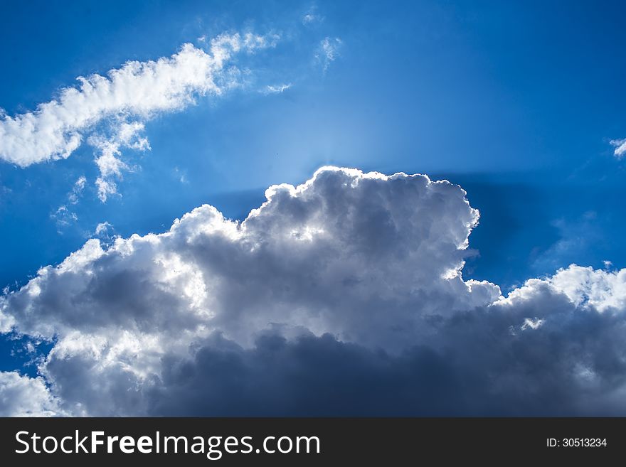 Fluffy white clouds in a blue sky. Fluffy white clouds in a blue sky