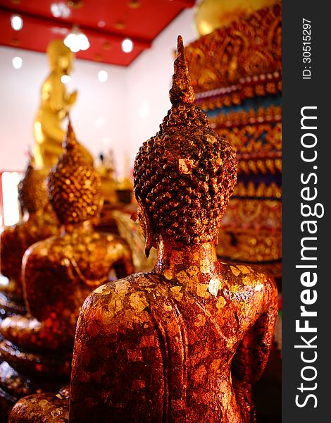 Ancient Buddha images in a Thai Buddhist temple, Thailand. Extremely shallow depth of field, good copy space. Ancient Buddha images in a Thai Buddhist temple, Thailand. Extremely shallow depth of field, good copy space.