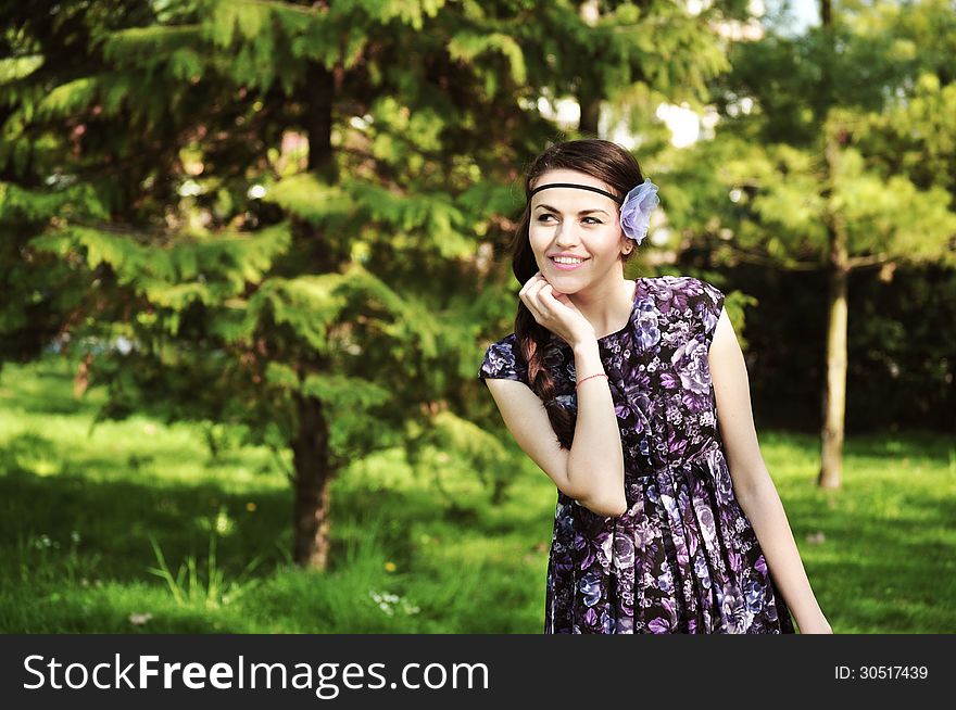 Portrait of the beautiful woman in the forest. Portrait of the beautiful woman in the forest