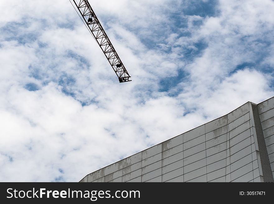 Tower Crane and Modern Architecture on Blue sky