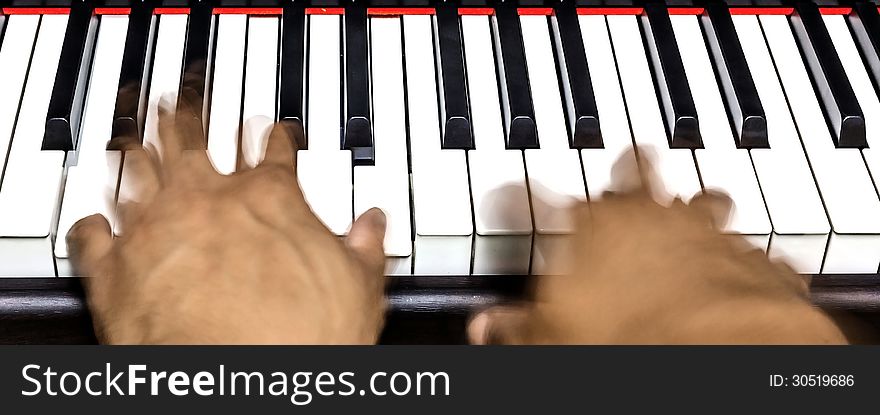 Two hands playing piano with motion. Two hands playing piano with motion