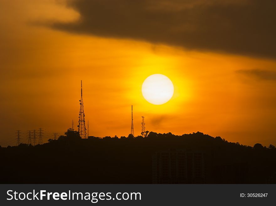 The sun setting over a satellite relay station. The sun setting over a satellite relay station.
