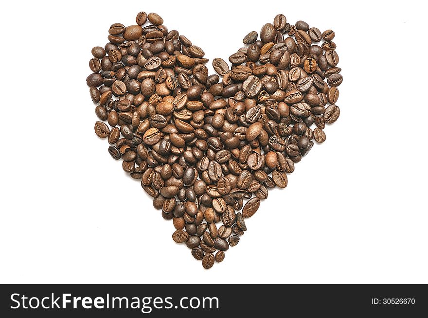 Heart shape coffee beans as a background isolated on white