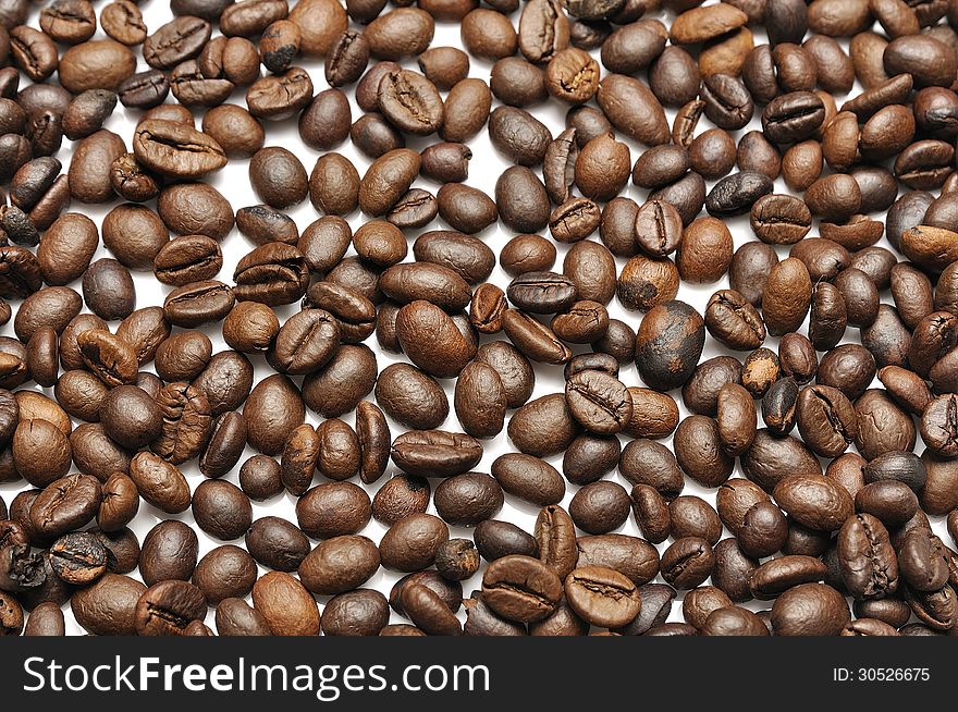 Coffee beans as a background on white. Coffee beans as a background on white