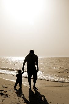 Dad And Child On The Beach At At Sunset Royalty Free Stock Photo