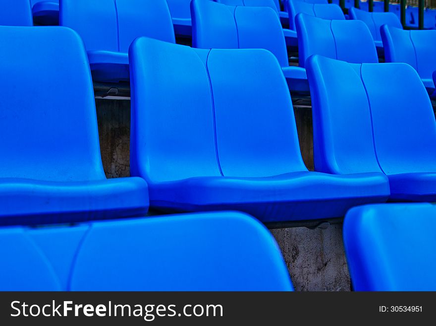 Blue plastic chairs in football stadium.thailand. Blue plastic chairs in football stadium.thailand
