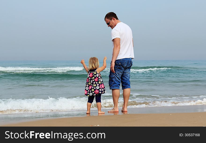 Father and daughter on the beach